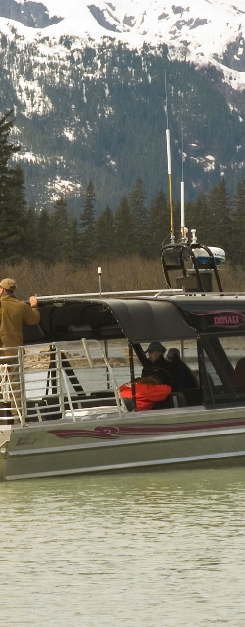 Tour boat on scenic mountain lake