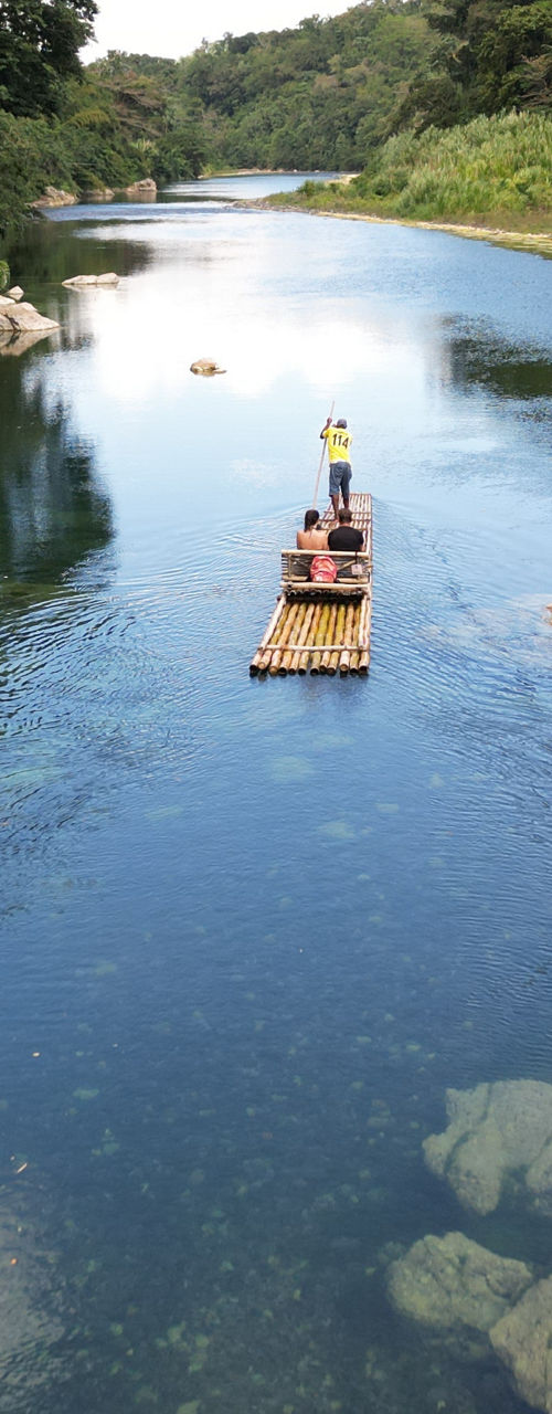 Wooden raft on serene tropical river