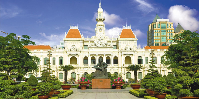 Historic building with Vietnam flag in cityscape