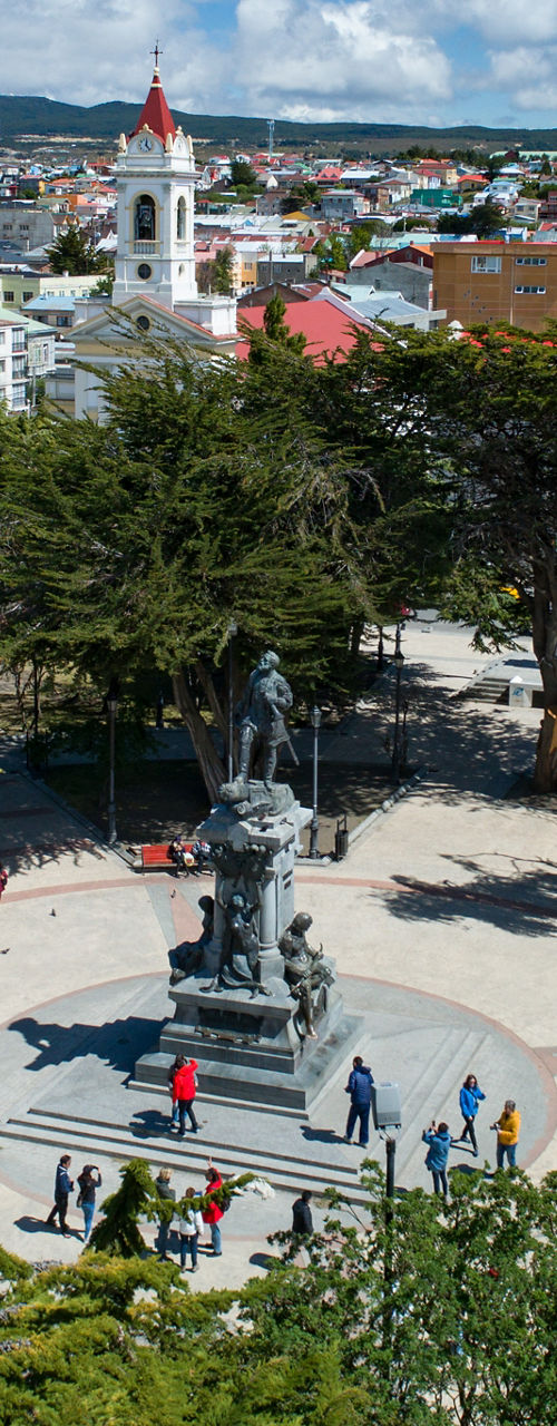 Scenic city plaza with statue and trees