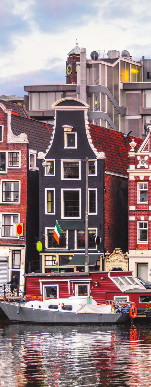 Colorful canal houses in Amsterdam cityscape