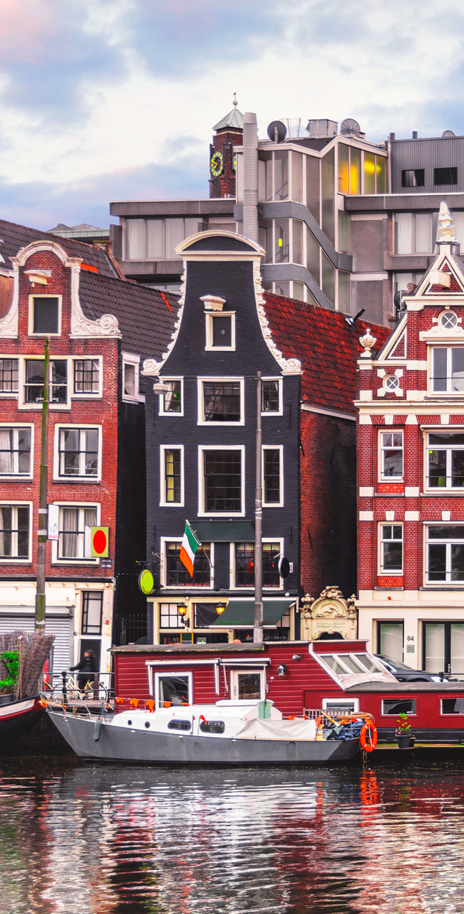 Colorful canal houses in Amsterdam cityscape