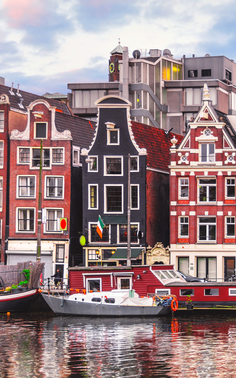 Colorful canal houses in Amsterdam cityscape