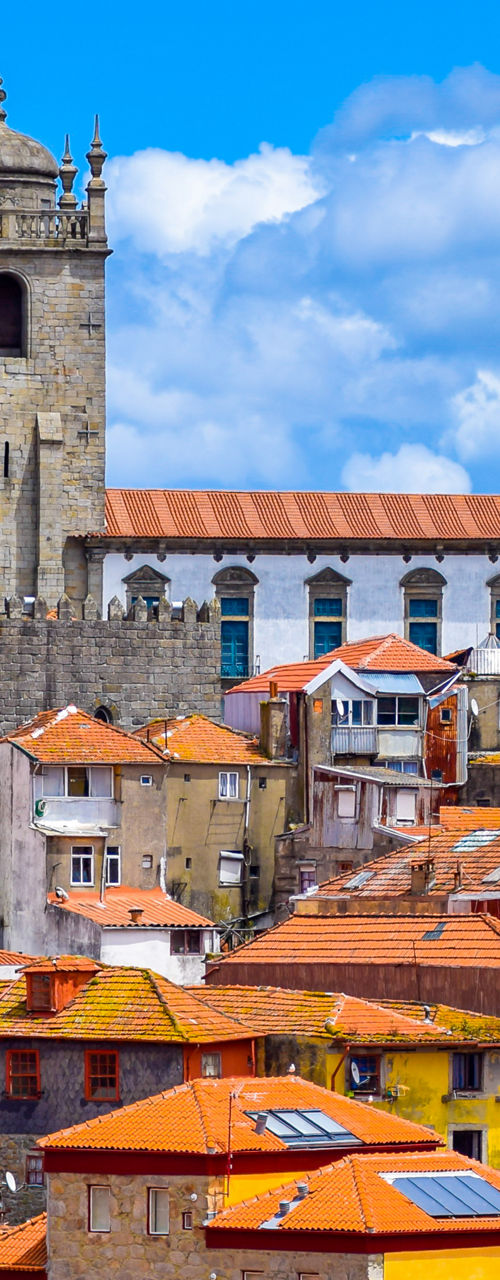 Historic cathedral overlooking colorful hillside city
