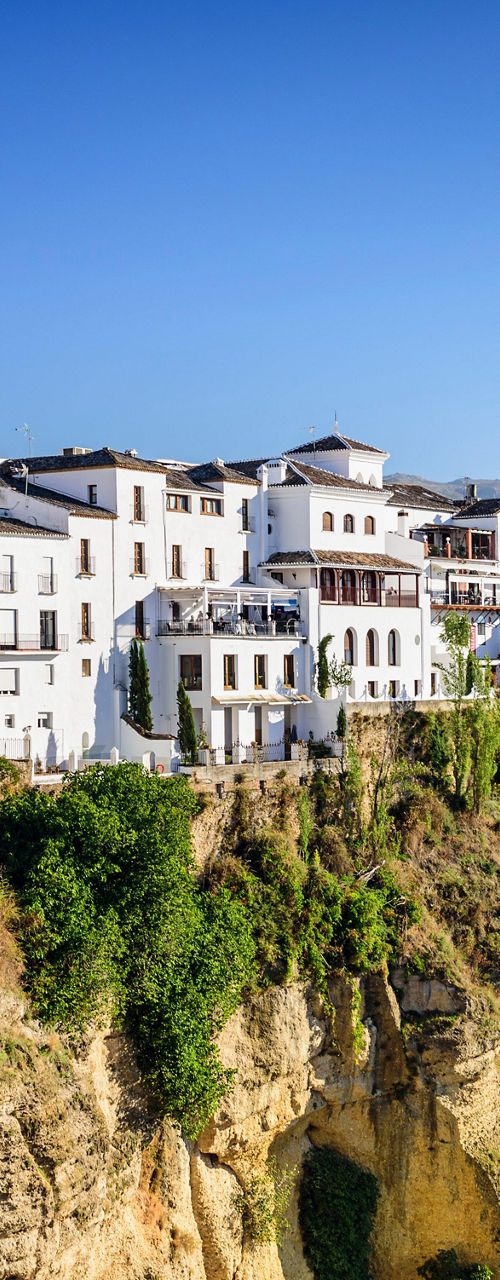 Whitewashed village on cliffside in Spain