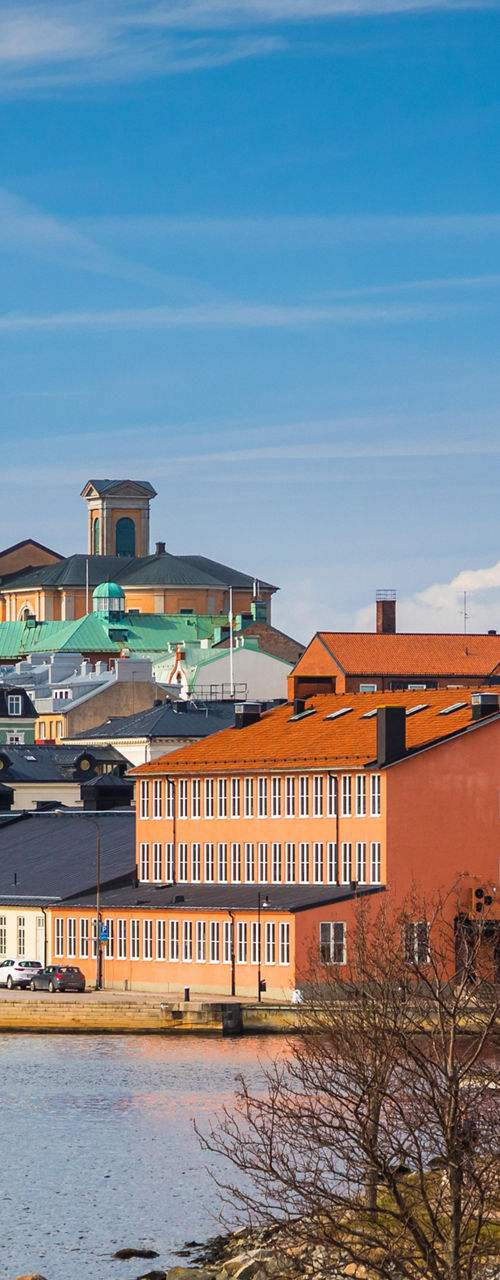 Scenic coastal town with white lighthouse