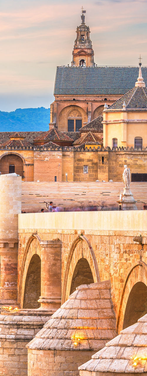 Historic Roman Bridge in Córdoba at Sunset