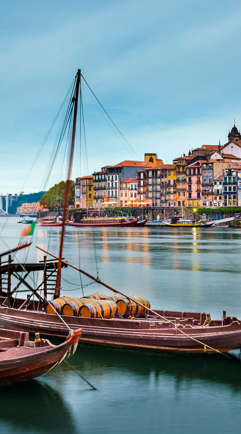 Traditional boats on serene river in Porto