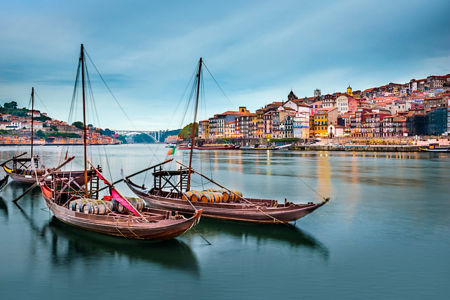 Traditional boats on serene river in Porto
