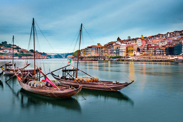Traditional boats on serene river in Porto