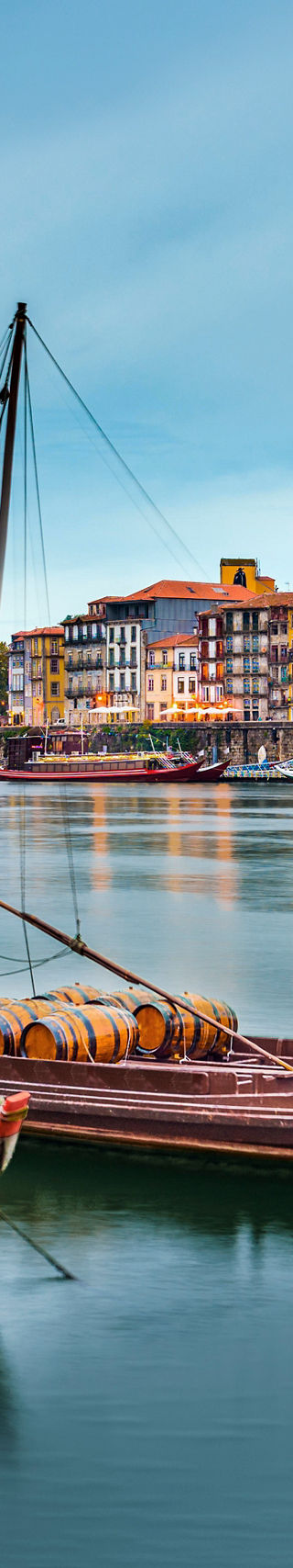 Traditional boats on serene river in Porto