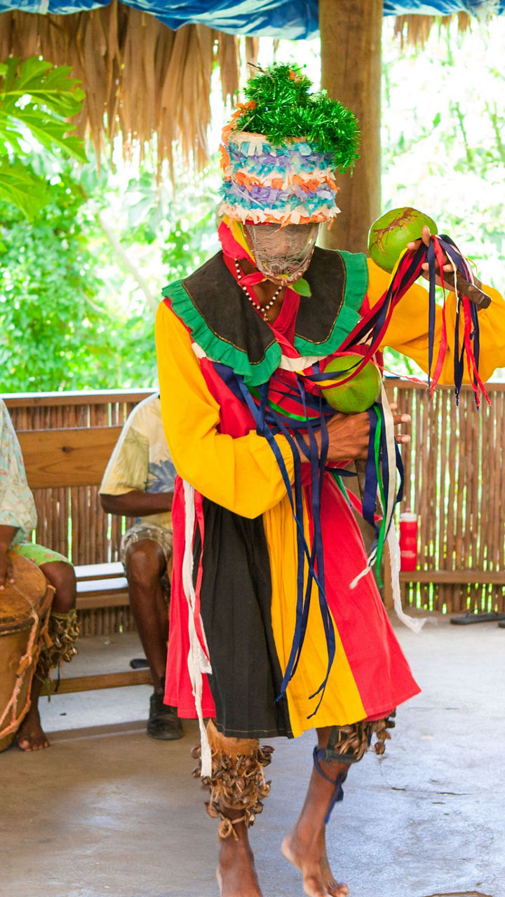Traditional dance performance in tropical setting