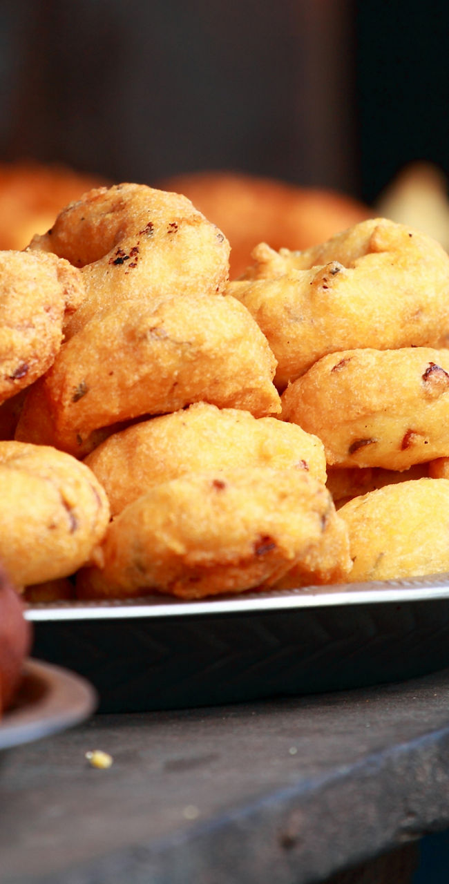 Assorted fried snacks on metal plates
