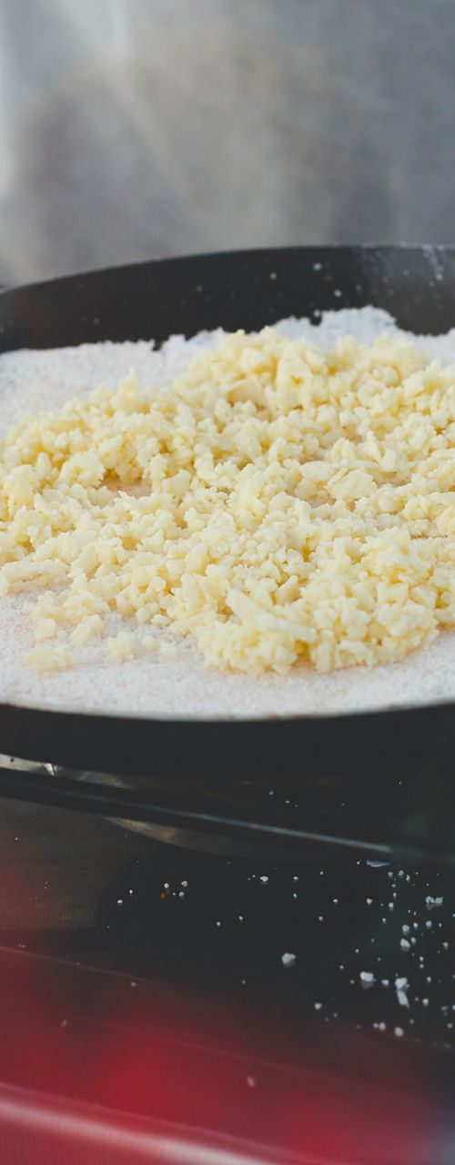 Cooking scrambled eggs on outdoor stove