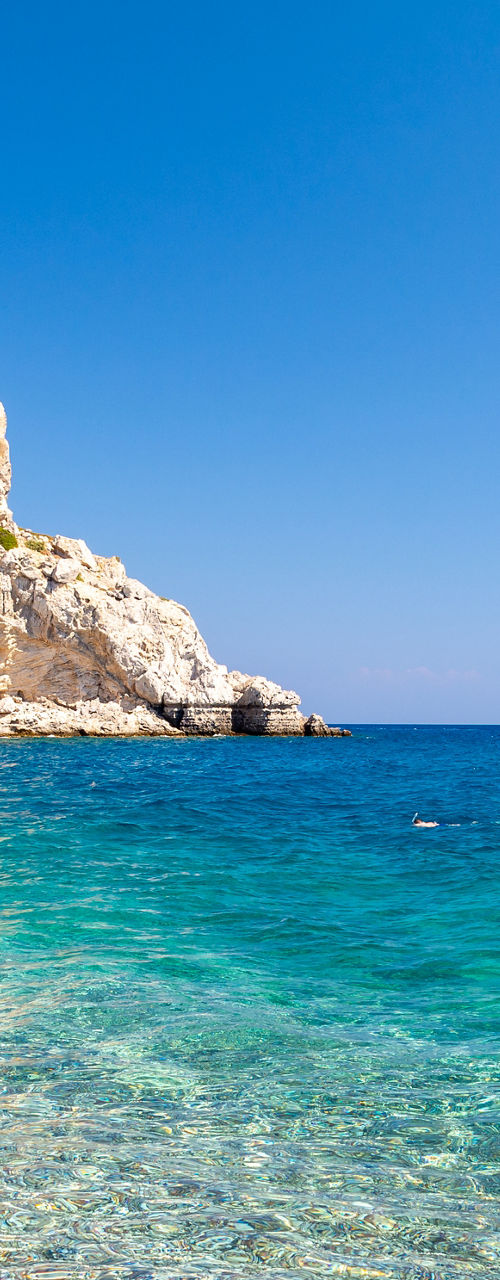 Sailboat on Clear Turquoise Waters