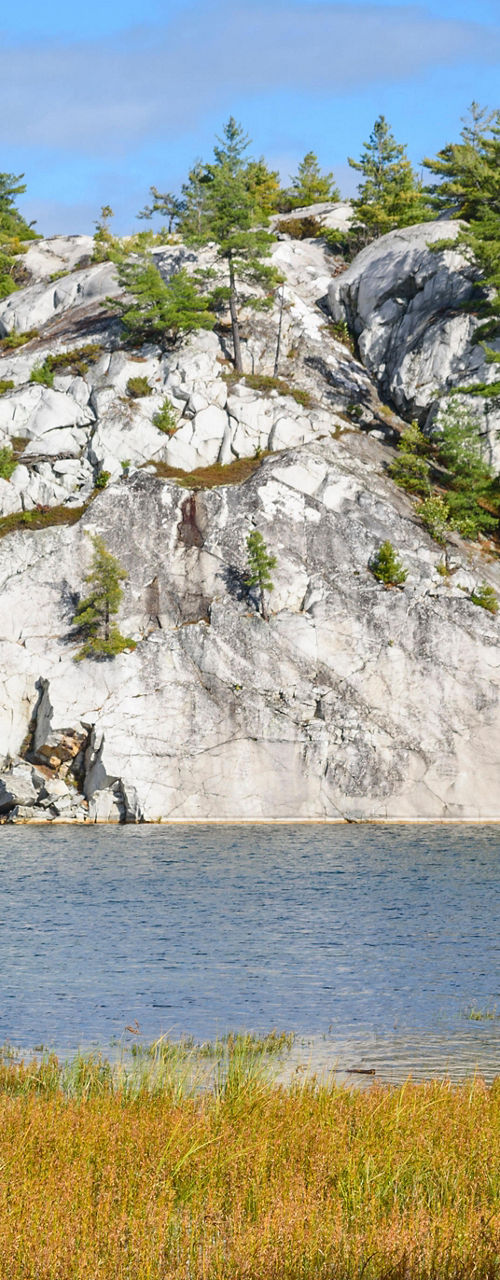 Scenic lake with rocky cliffs and trees