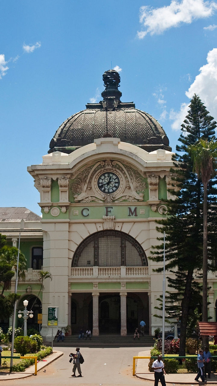 Historic railway station under bright blue sky