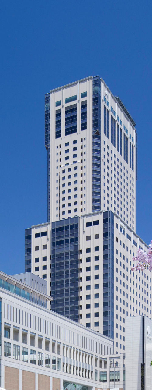 Modern urban architecture with blooming trees