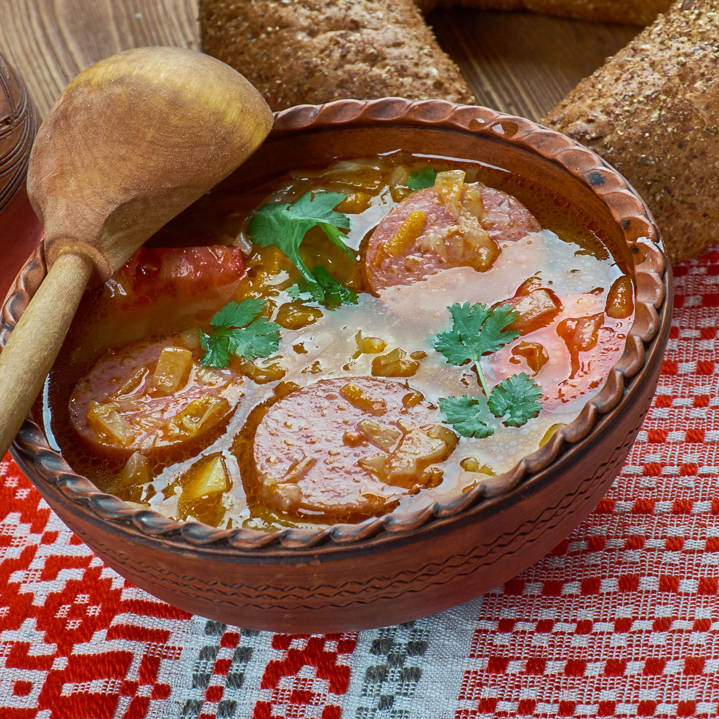 Traditional soup in rustic ceramic bowl