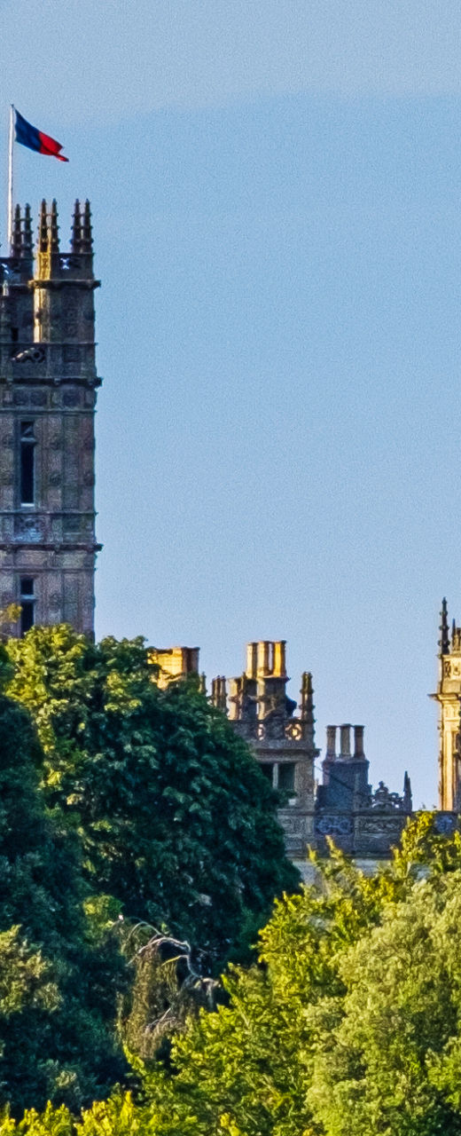 Historic castle surrounded by lush greenery