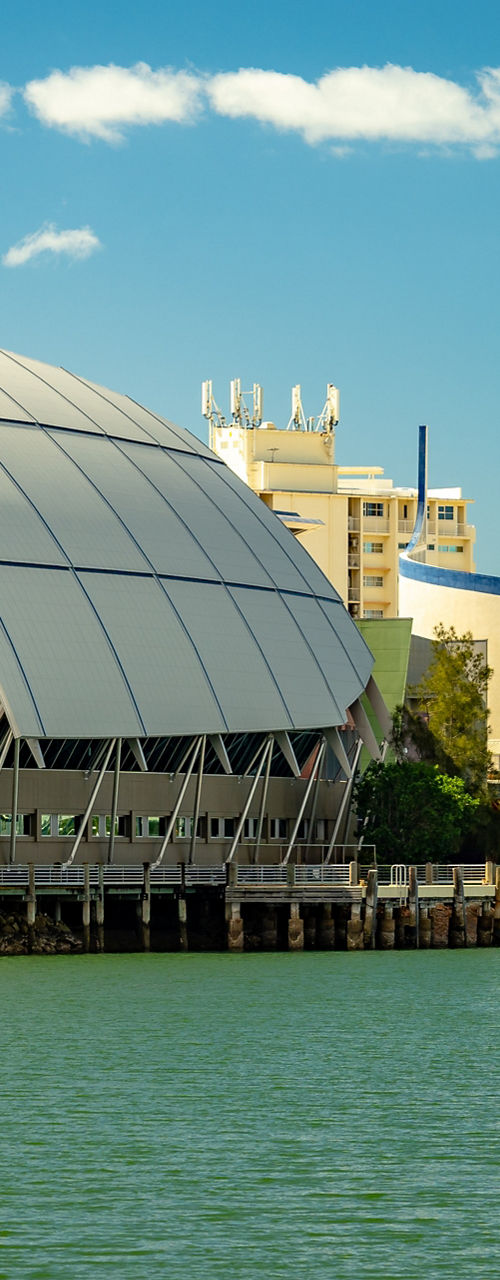 Modern waterfront museum with sailboats