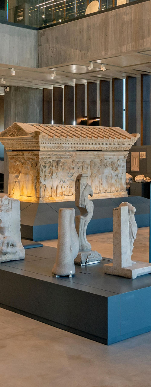 Modern museum interior with ancient sculptures