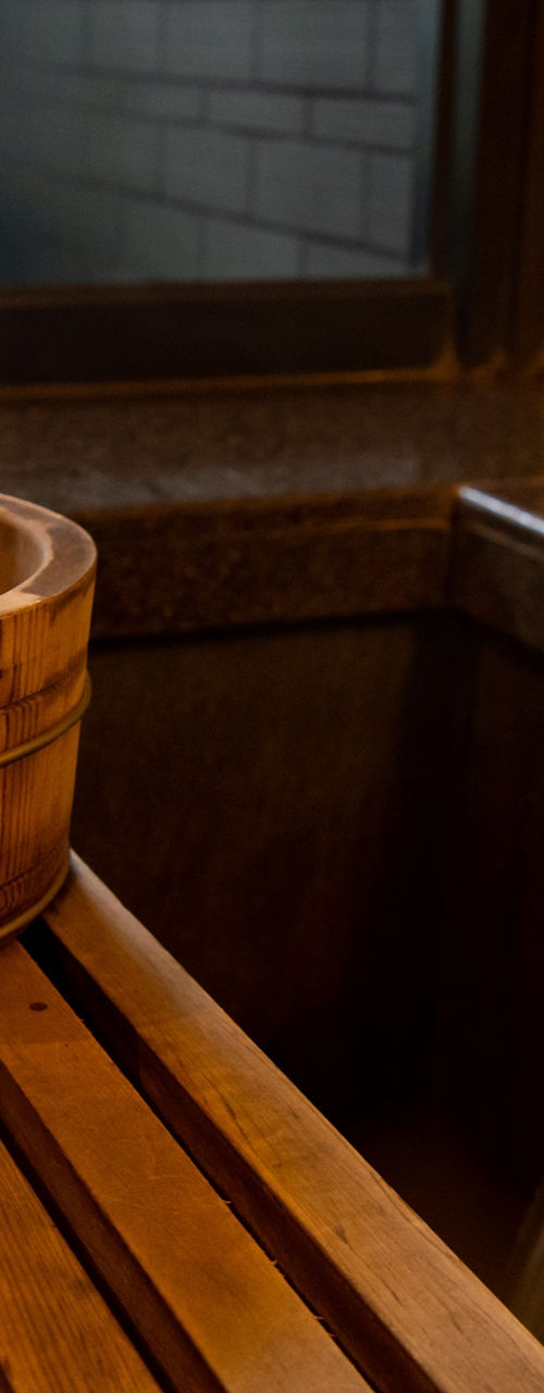 Wooden bucket in serene spa setting