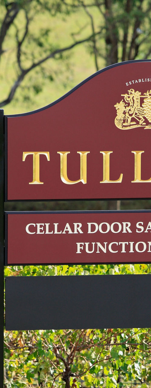 Tulloch vineyard sign in lush setting