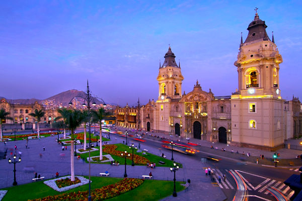 Historic cathedral in vibrant cityscape at dusk