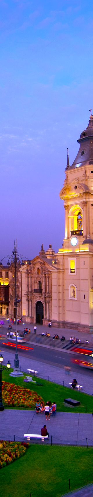 Historic cathedral in vibrant cityscape at dusk