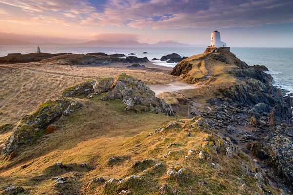 Scenic lighthouse on rocky coastal landscape