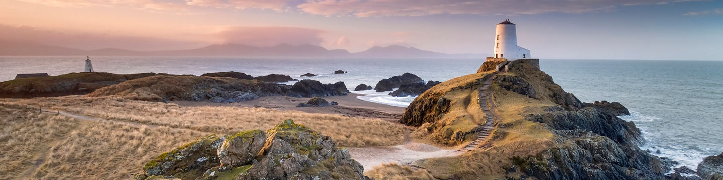 Scenic lighthouse on rocky coastal landscape