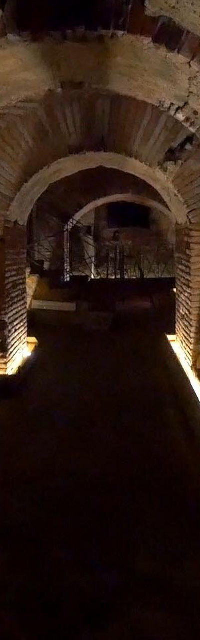 Illuminated ancient brick tunnel interior