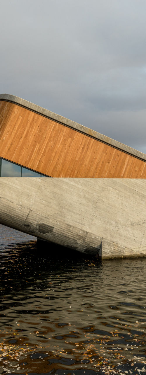Modern coastal structure extending into sea