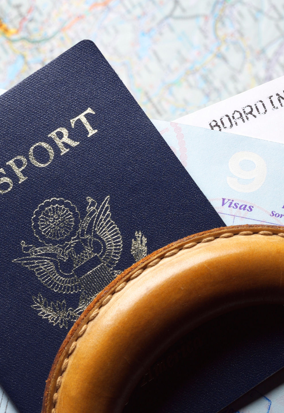 Passport and boarding pass on luggage