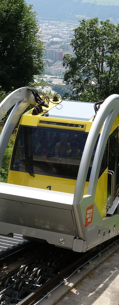 Modern funicular train on hillside track