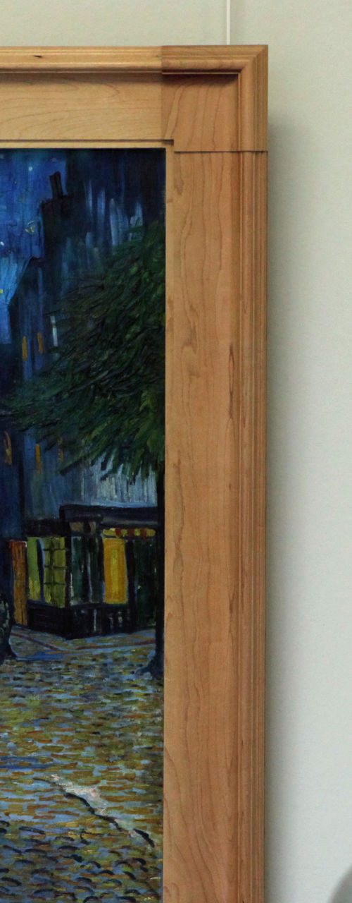 Man observing Van Gogh painting in gallery