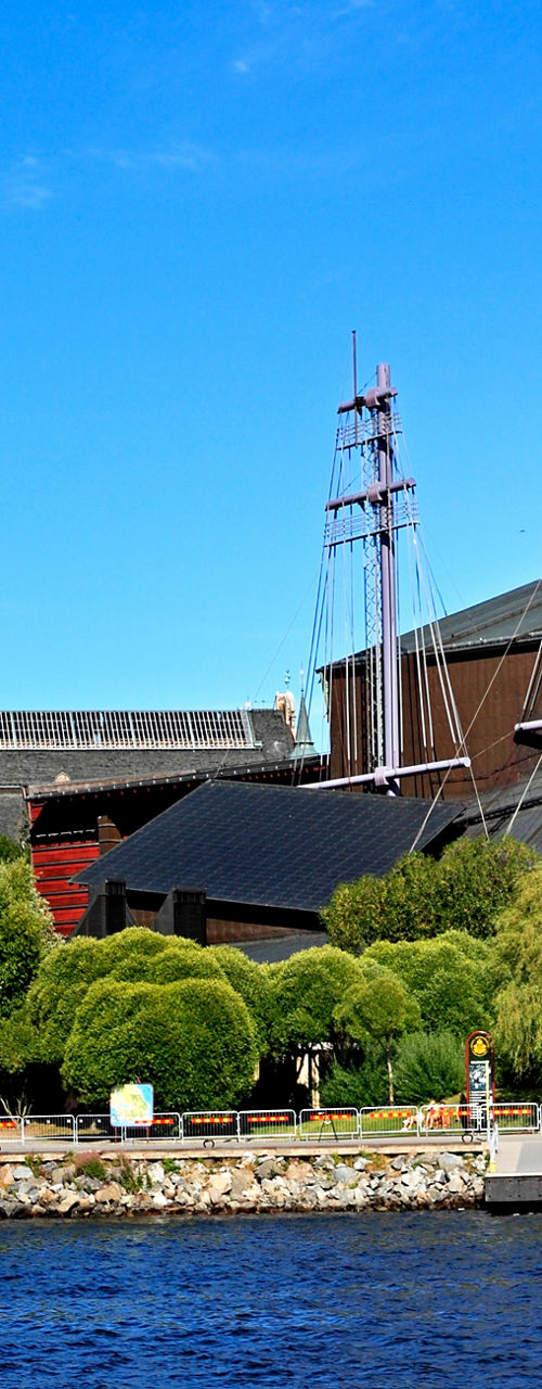 Historic waterfront with ship and museum