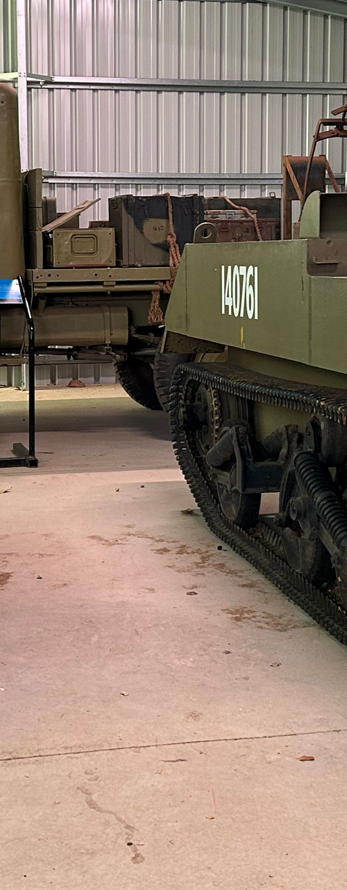Historic military vehicles displayed in museum shed