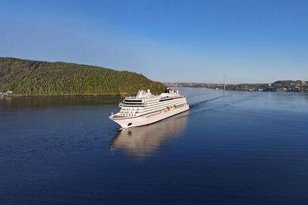 Luxury cruise ship sailing scenic waters