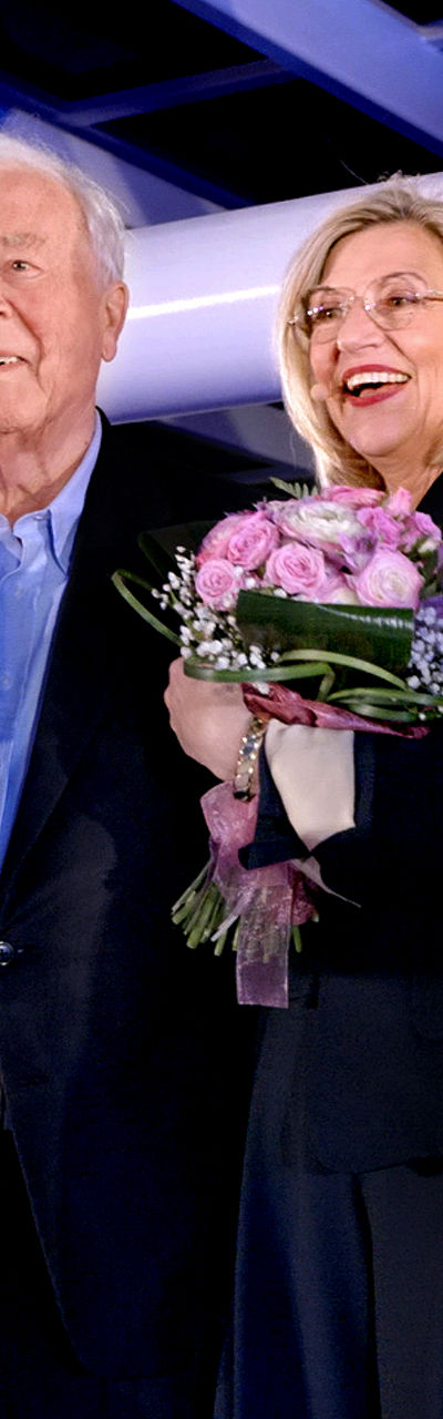Group gathering with floral bouquet indoors