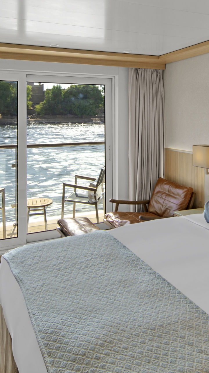 Luxury river cruise cabin with balcony view