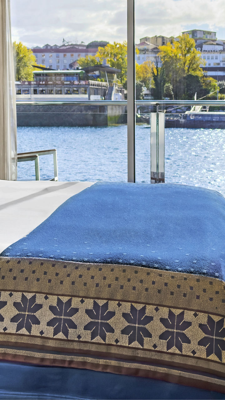 Modern riverside hotel room with balcony view