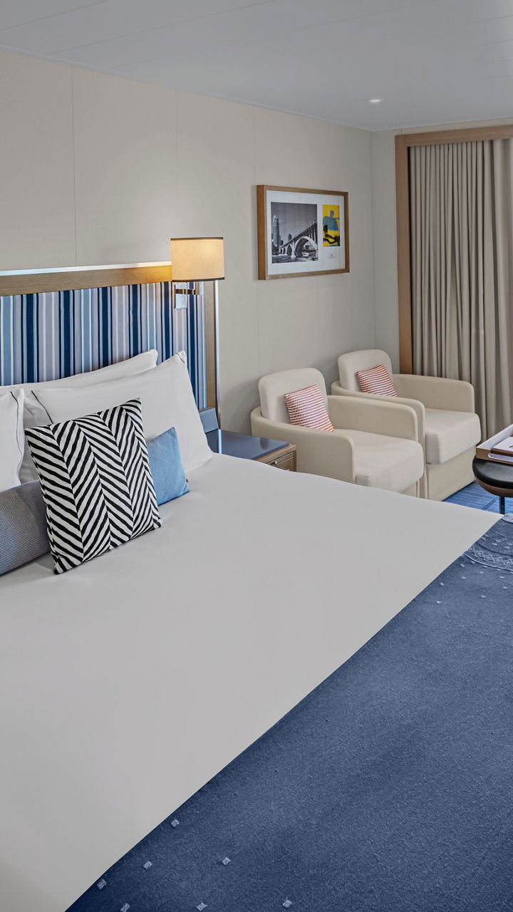 Modern cruise ship cabin with balcony view