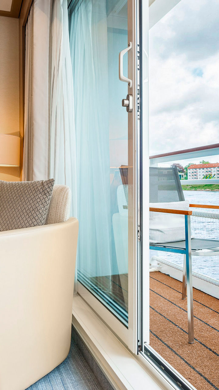 Modern river cruise cabin with balcony view