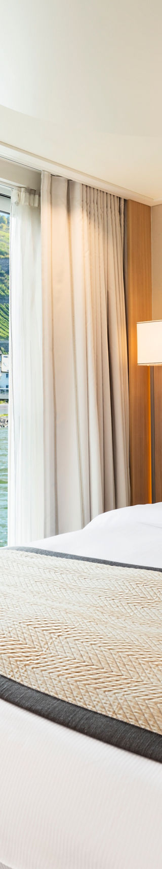 Luxury riverside hotel room with scenic view