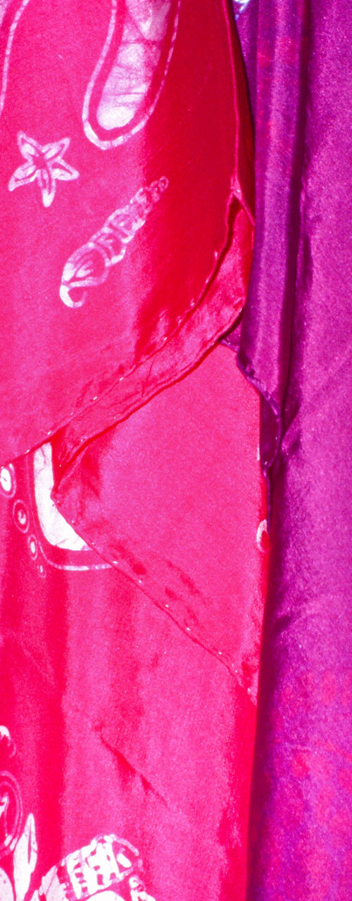 Colorful patterned fabrics hanging in display