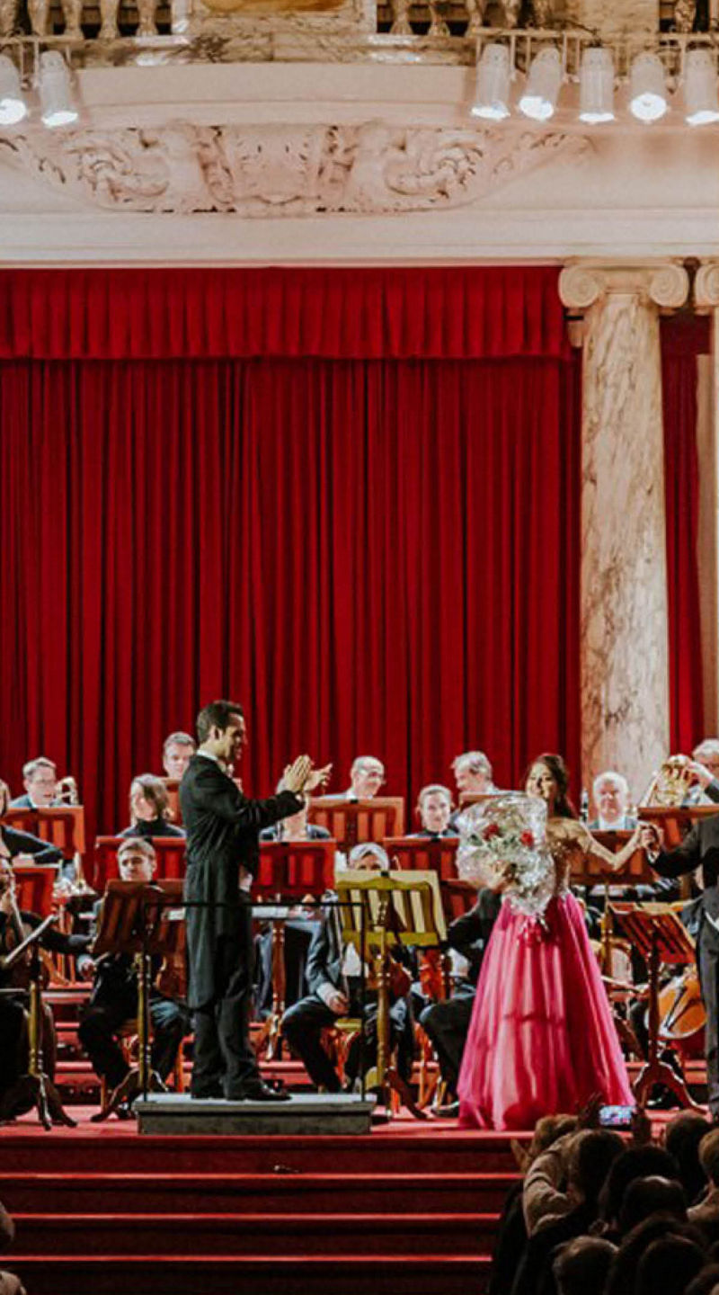 Orchestra performance in grand concert hall