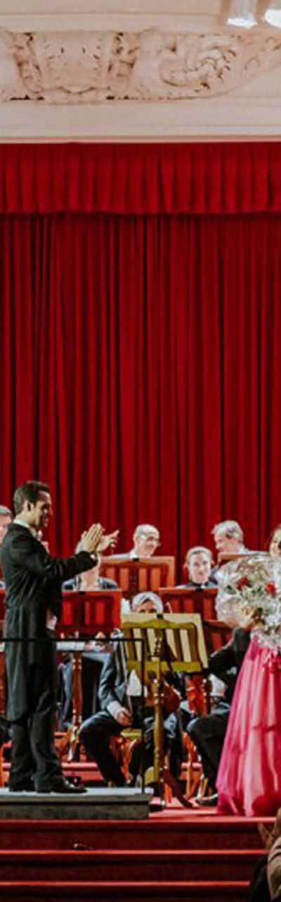 Orchestra performance in grand concert hall