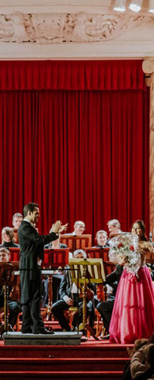 Orchestra performance in grand concert hall